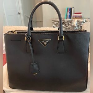 Authantic Black Prada Saffiano Lux with card and dust bag.